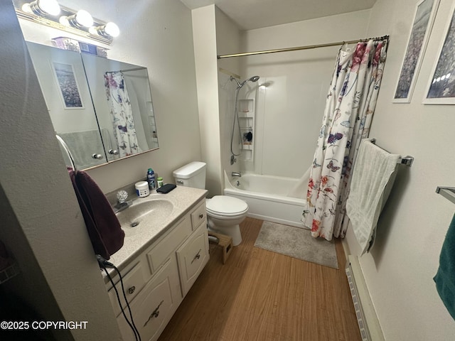 bathroom featuring wood finished floors, shower / tub combo with curtain, toilet, and vanity