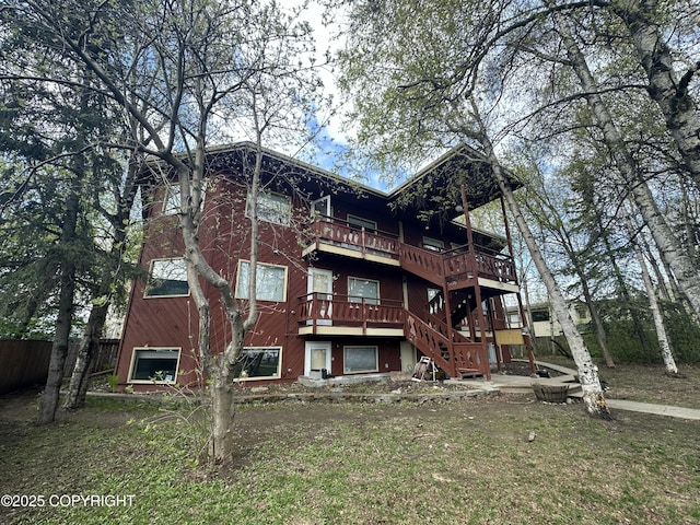 back of property with fence