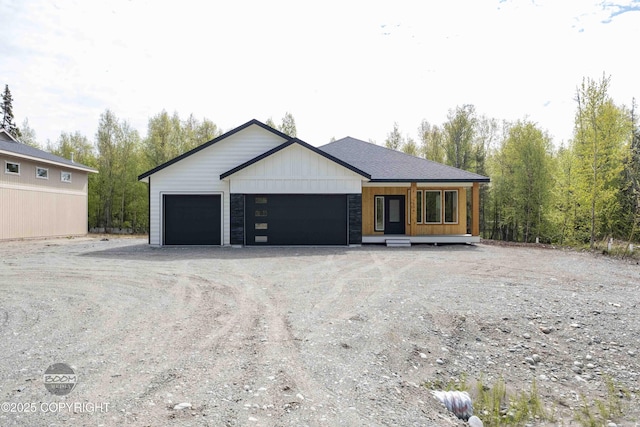 7254 E Riparian Loop, Palmer, AK 99645 - view of front of property featuring dirt driveway and an attached garage