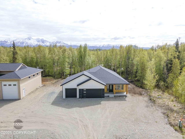 7254 E Riparian Loop, Palmer, AK 99645 - view of subject property with a heavily wooded area and a mountain backdrop