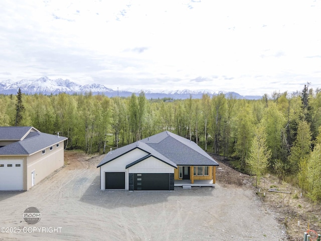 7254 E Riparian Loop, Palmer, AK 99645 - view from above of property featuring a heavily wooded area and a mountainous background