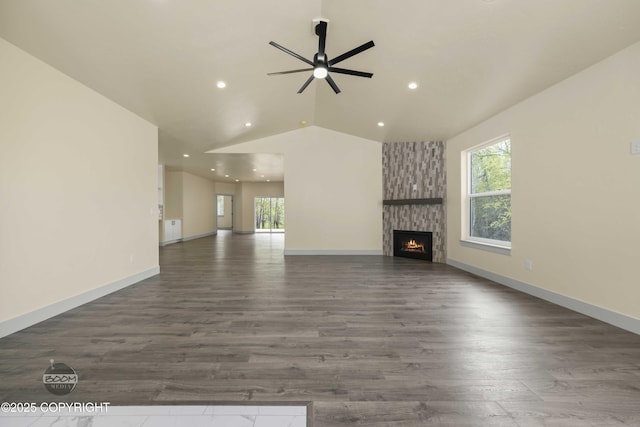 7254 E Riparian Loop, Palmer, AK 99645 - unfurnished living room with ceiling fan, wood finished floors, vaulted ceiling, recessed lighting, and a stone fireplace
