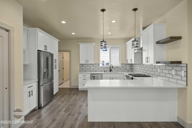 7254 E Riparian Loop, Palmer, AK 99645 - kitchen with stainless steel appliances, a peninsula, open shelves, backsplash, and recessed lighting