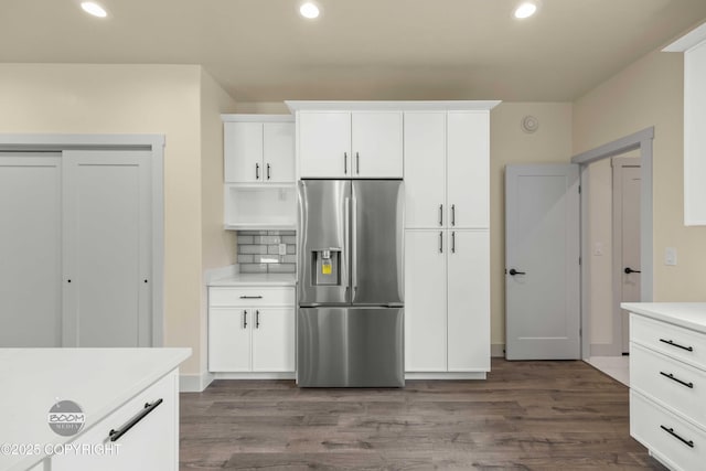 7254 E Riparian Loop, Palmer, AK 99645 - kitchen featuring stainless steel refrigerator with ice dispenser, recessed lighting, dark wood-type flooring, light countertops, and white cabinetry