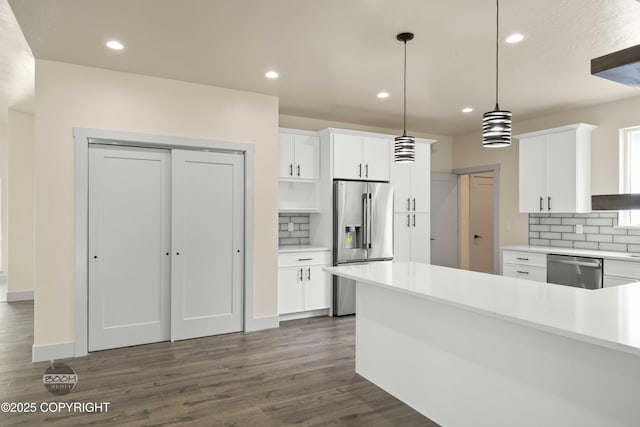 7254 E Riparian Loop, Palmer, AK 99645 - kitchen with appliances with stainless steel finishes, backsplash, dark wood finished floors, white cabinets, and recessed lighting