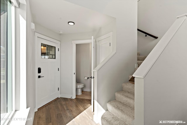 7863 Gate Creek Dr, Anchorage, AK 99502 - entrance foyer with wood finished floors and stairs