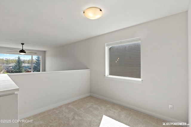 7863 Gate Creek Dr, Anchorage, AK 99502 - carpeted spare room featuring a ceiling fan and baseboards