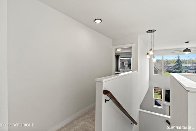 7863 Gate Creek Dr, Anchorage, AK 99502 - hall featuring an upstairs landing, carpet floors, and baseboards