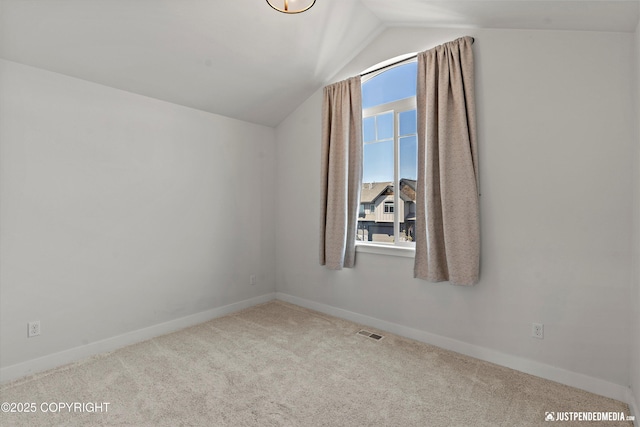 7863 Gate Creek Dr, Anchorage, AK 99502 - additional living space featuring carpet, vaulted ceiling, and baseboards