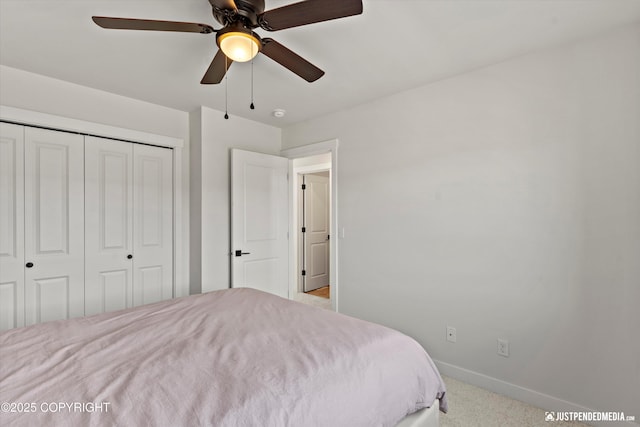 7863 Gate Creek Dr, Anchorage, AK 99502 - bedroom featuring carpet flooring, baseboards, a closet, and a ceiling fan