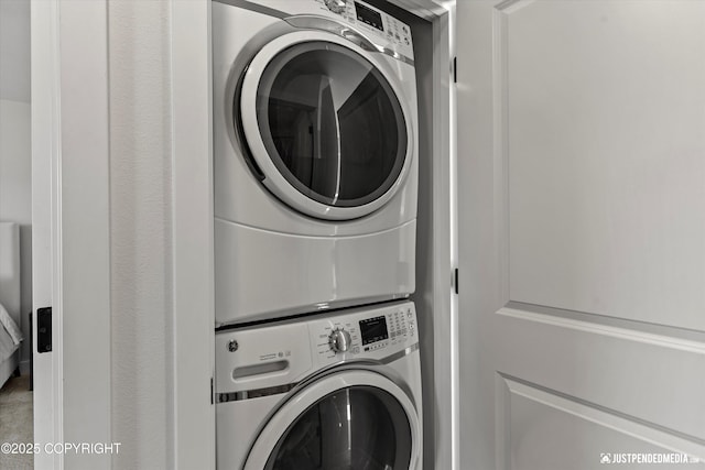 7863 Gate Creek Dr, Anchorage, AK 99502 - washroom with stacked washer / dryer