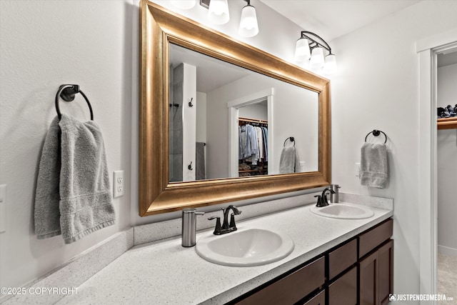 7863 Gate Creek Dr, Anchorage, AK 99502 - bathroom featuring double vanity and a spacious closet