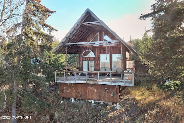 back of house with a wooden deck