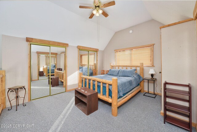 bedroom with multiple closets, vaulted ceiling, carpet, and ceiling fan