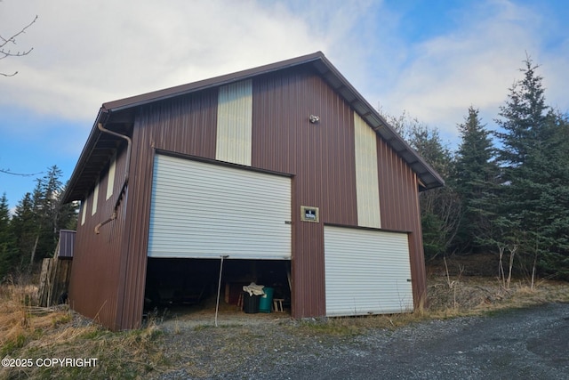 view of side of home with an outbuilding and a garage