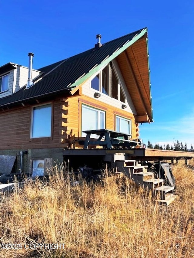31580 Hannah Rene Rd, Anchor Point, AK 99556 - back of house featuring log siding and metal roof