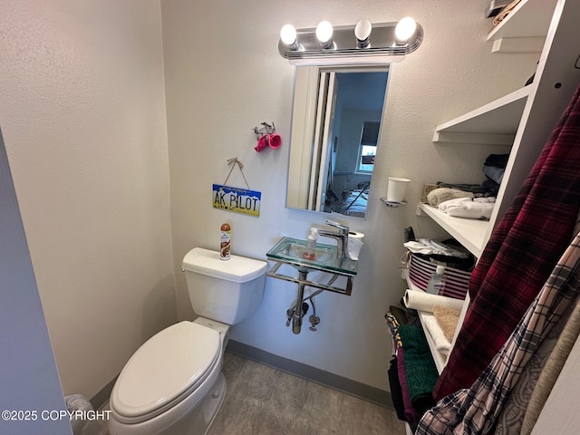 31580 Hannah Rene Rd, Anchor Point, AK 99556 - half bath featuring toilet and wood finished floors