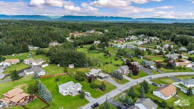aerial view of residential area featuring a heavily wooded area