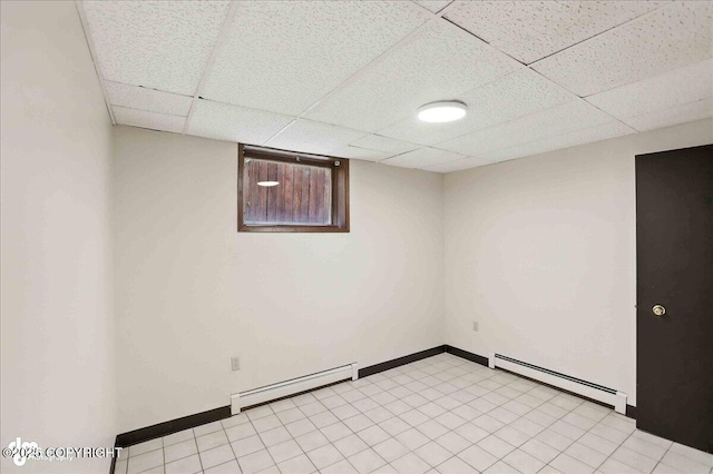933 W 20th Ave, Anchorage, AK 99503 - basement with a baseboard radiator and a drop ceiling