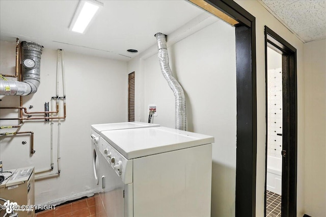 933 W 20th Ave, Anchorage, AK 99503 - washroom with washing machine and dryer and tile patterned floors