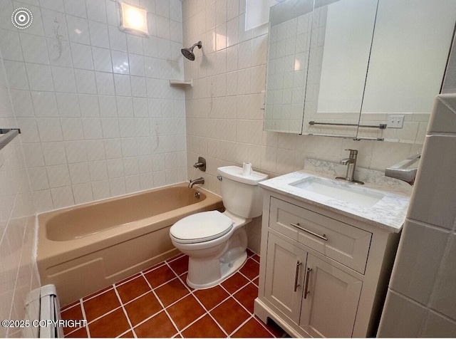 933 W 20th Ave, Anchorage, AK 99503 - full bathroom with tile walls, vanity, tile patterned flooring, and shower / bath combination