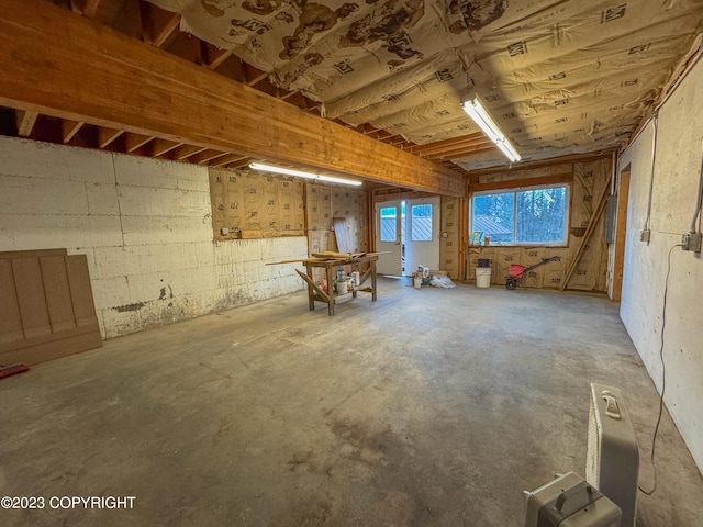 misc room with unfinished concrete flooring