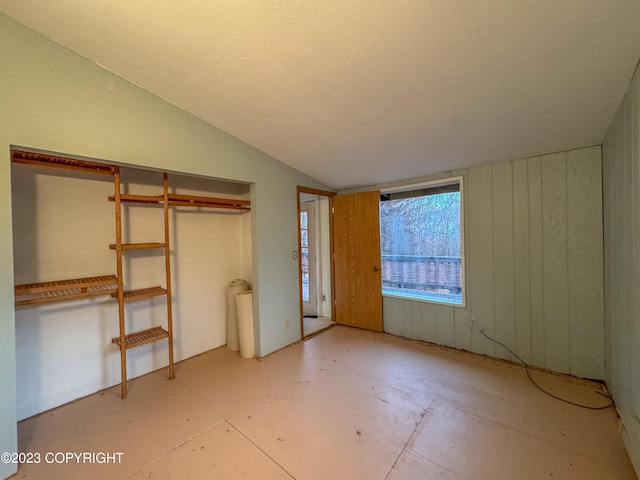 unfurnished bedroom featuring a closet and vaulted ceiling
