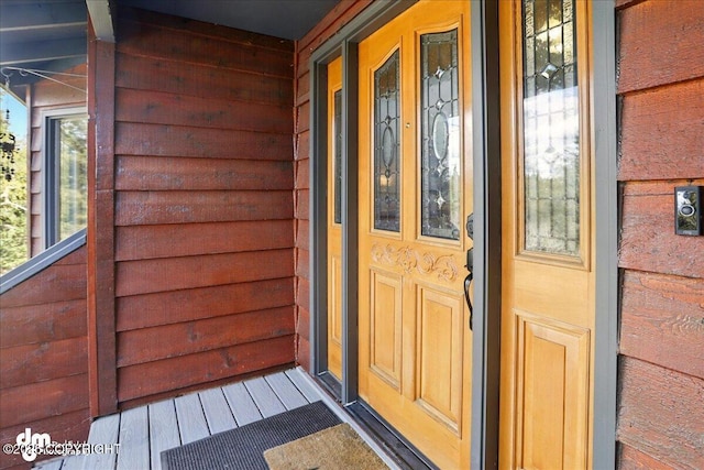 entrance to property featuring a porch