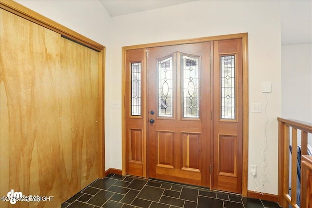foyer featuring baseboards