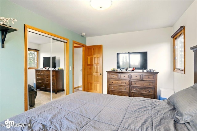 carpeted bedroom featuring a closet