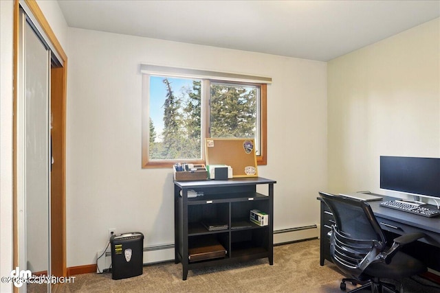 carpeted office featuring a baseboard heating unit and baseboard heating