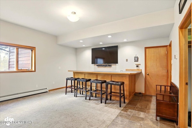 indoor wet bar featuring a baseboard heating unit, recessed lighting, and baseboards