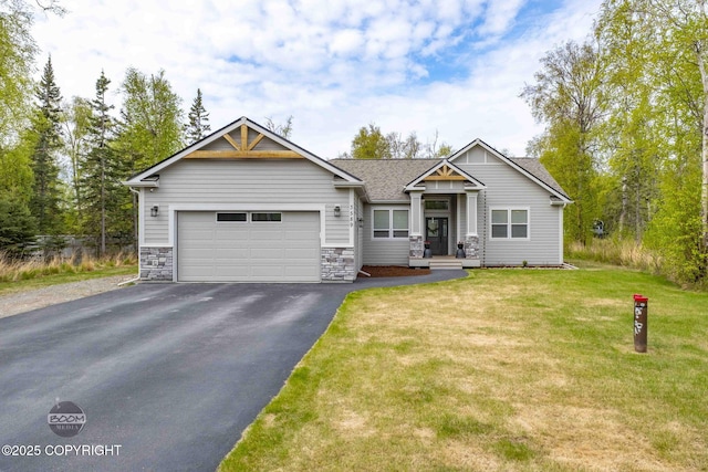 3589 N Magnolia Cir, Wasilla, AK 99654 - craftsman house with asphalt driveway, a garage, a front lawn, stone siding, and a shingled roof