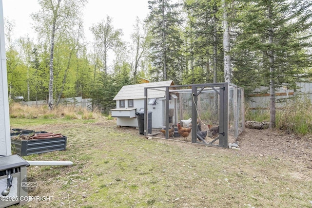 3589 N Magnolia Cir, Wasilla, AK 99654 - view of yard with exterior structure, an outdoor structure, and fence
