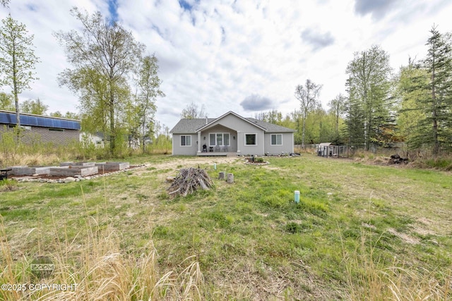 3589 N Magnolia Cir, Wasilla, AK 99654 - rear view of house featuring a lawn and stucco siding