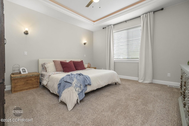 3589 N Magnolia Cir, Wasilla, AK 99654 - bedroom featuring carpet floors, baseboards, a tray ceiling, ceiling fan, and crown molding