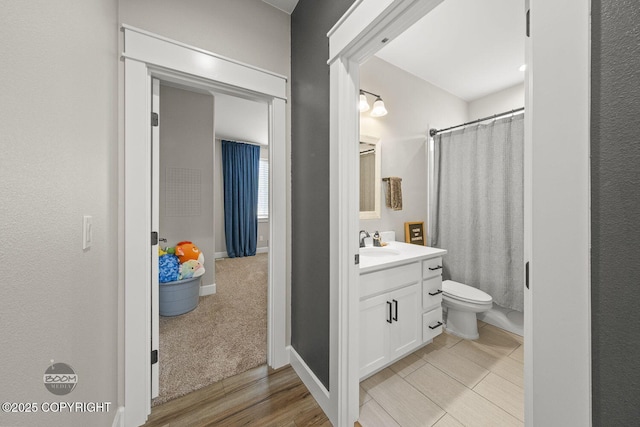3589 N Magnolia Cir, Wasilla, AK 99654 - full bath with vanity, toilet, a shower with curtain, and baseboards