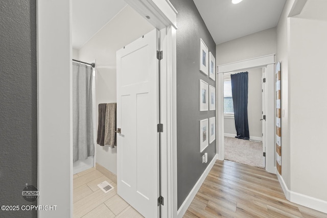 3589 N Magnolia Cir, Wasilla, AK 99654 - hallway featuring baseboards and light wood-type flooring
