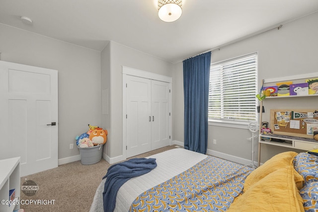 3589 N Magnolia Cir, Wasilla, AK 99654 - carpeted bedroom featuring a closet and baseboards