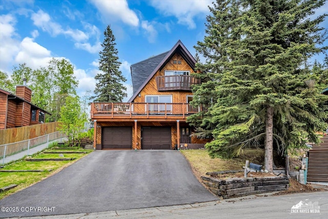 6010 Staedem Dr, Anchorage, AK 99504 - view of front of property with a balcony, driveway, and an attached garage