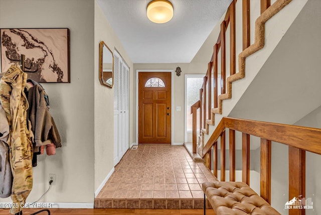 6010 Staedem Dr, Anchorage, AK 99504 - entrance foyer featuring stairs and baseboards