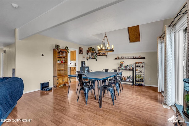 6010 Staedem Dr, Anchorage, AK 99504 - dining space with a chandelier, light wood finished floors, and baseboards