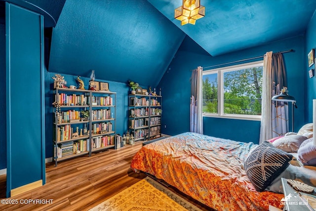 6010 Staedem Dr, Anchorage, AK 99504 - bedroom with wood finished floors and lofted ceiling
