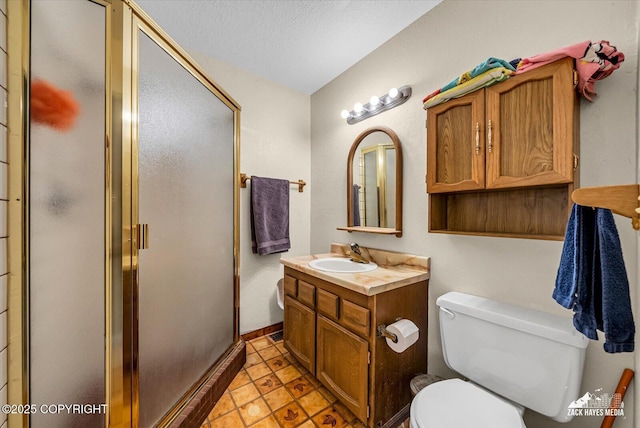 6010 Staedem Dr, Anchorage, AK 99504 - full bath with vanity, toilet, a stall shower, a textured ceiling, and tile patterned flooring