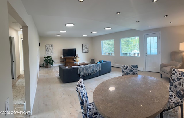 741 W 20th Ave, Anchorage, AK 99503 - living area featuring light wood-type flooring, recessed lighting, baseboards, and a baseboard radiator