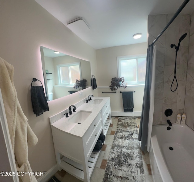 741 W 20th Ave, Anchorage, AK 99503 - bathroom with plenty of natural light, shower / bathtub combination with curtain, double vanity, and baseboards