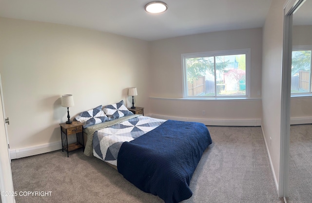 741 W 20th Ave, Anchorage, AK 99503 - bedroom with carpet flooring, multiple windows, a baseboard radiator, and baseboards