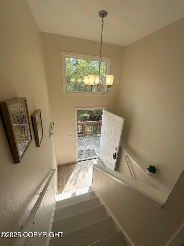 741 W 20th Ave, Anchorage, AK 99503 - staircase with a chandelier