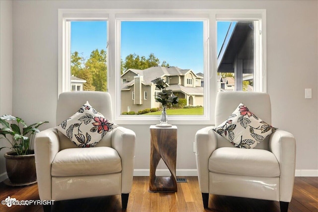3833 Eastwind Dr, Anchorage, AK 99516 - living area with baseboards, wood finished floors, and plenty of natural light