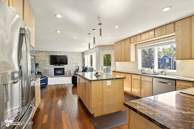 3833 Eastwind Dr, Anchorage, AK 99516 - kitchen with stainless steel appliances, light brown cabinets, a sink, plenty of natural light, and recessed lighting